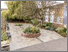 [thumbnail of Paving laid in rose garden, with circular apertures left for handmade tiles to be installed]