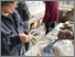 [thumbnail of Adding the blue slip to the white body, to fill the patterns made with the hand made stamps]